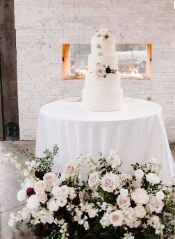 Classic white wedding cake displayed at Rose Briar Place