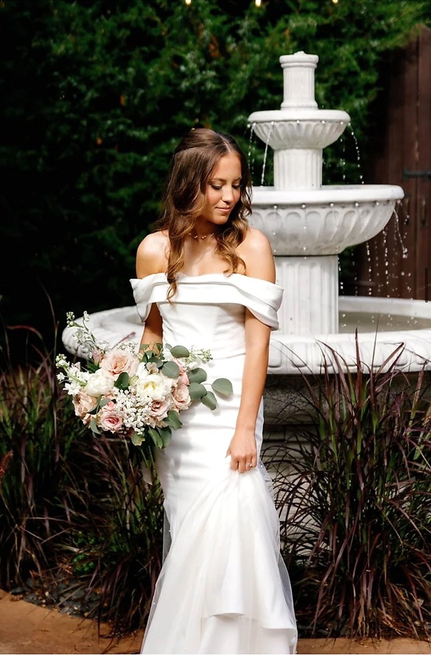 Bride with bouquet in the Rose Briar Place garden